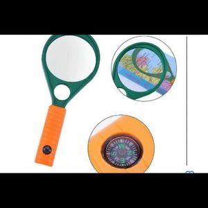 MAGNIFYING GLASS LENS WITH COMPASS